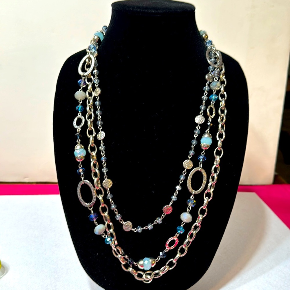 Beautiful multi chain necklace. Heavy piece with blue stones and three chains.
